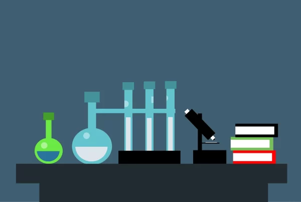 Imagem de um microscópio, tubos de ensaio e livros em um laboratório